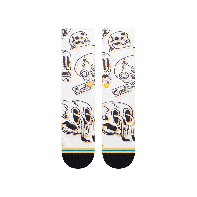 TALKIN HEADS CREW C SOCK 2023 - A pair of white crew socks with a repeating pattern of cartoon skulls and the word "cool" in black, outlined in yellow.