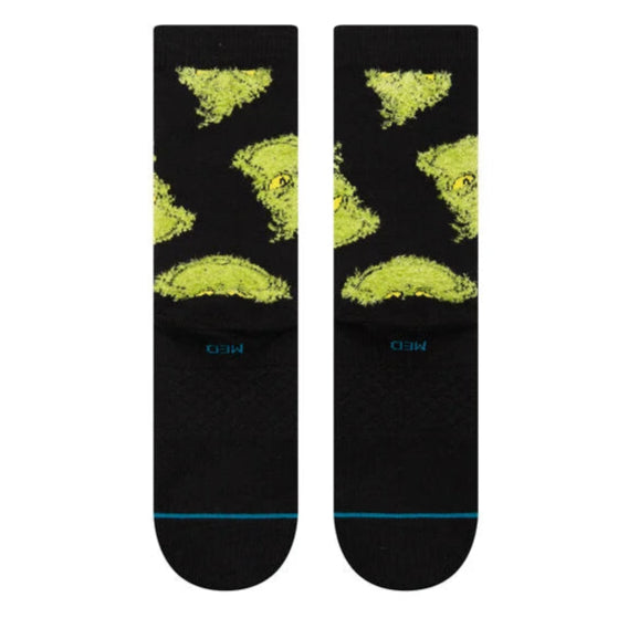 Stance Mean One Crew Sock 2025 - A black crew sock with a green and yellow abstract design on top.