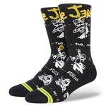 Stance Circle Jerks X Stance Crew Socks 2023 - Black crew socks with white and yellow graphics of a man's face, featuring the band's name in stylized font at top.