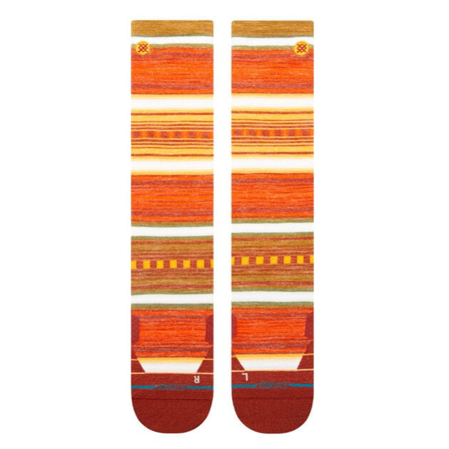 Stance Windy Pine Ultralight Wool Snow Sock 2025 - A pair of orange and brown striped snow socks with a repeating pine tree pattern.