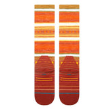 Stance Windy Pine Ultralight Wool Snow Sock 2025 - A pair of orange and yellow striped snow socks with a repeating pine tree pattern.
