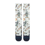 Stance Feeling Pickled Snow Sock 2025 - A pair of snow socks with a light blue background featuring cartoon pickles wearing goggles and helmets, some holding skis or snowboards.