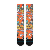 Stance X Looney Tunes Snow Sock 2025 - Looney Tunes characters on an orange background with yellow lettering.