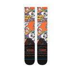 Stance X Looney Tunes Snow Sock 2025 - Looney Tunes characters in purple, white and orange on an orange background.