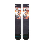 Stance X Outkast Snow Sock 2025 - A pair of black snow socks with a repeating pattern featuring three men from the hip-hop group OutKast, wearing white shirts and gold chains, set against an orange background.