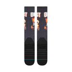 Stance X Outkast Snow Sock 2025 - A pair of black snow socks with an orange and white OutKast logo on the top.