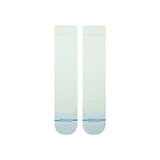 Stance Traveleer Snow Sock 2025 - A pair of white snow socks with a small logo on top and a blue stripe at the bottom.