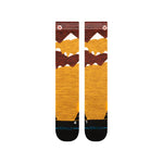Stance Windy Peaks Snow Sock 2025 - A pair of snow socks with a brown and yellow color scheme, featuring a mountain range design on top.
