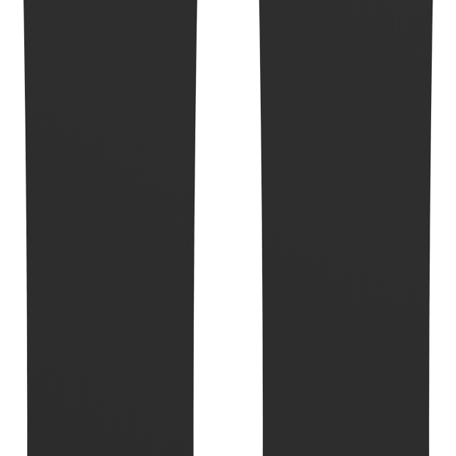 Dark slate Atomic Maven skis, gold tip graphic and 'ATOMIC' text near top