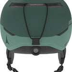 Atomic Four Amid Helmet 2025 - A dark green helmet with a matte finish, featuring a black chin strap and a small logo on the side.