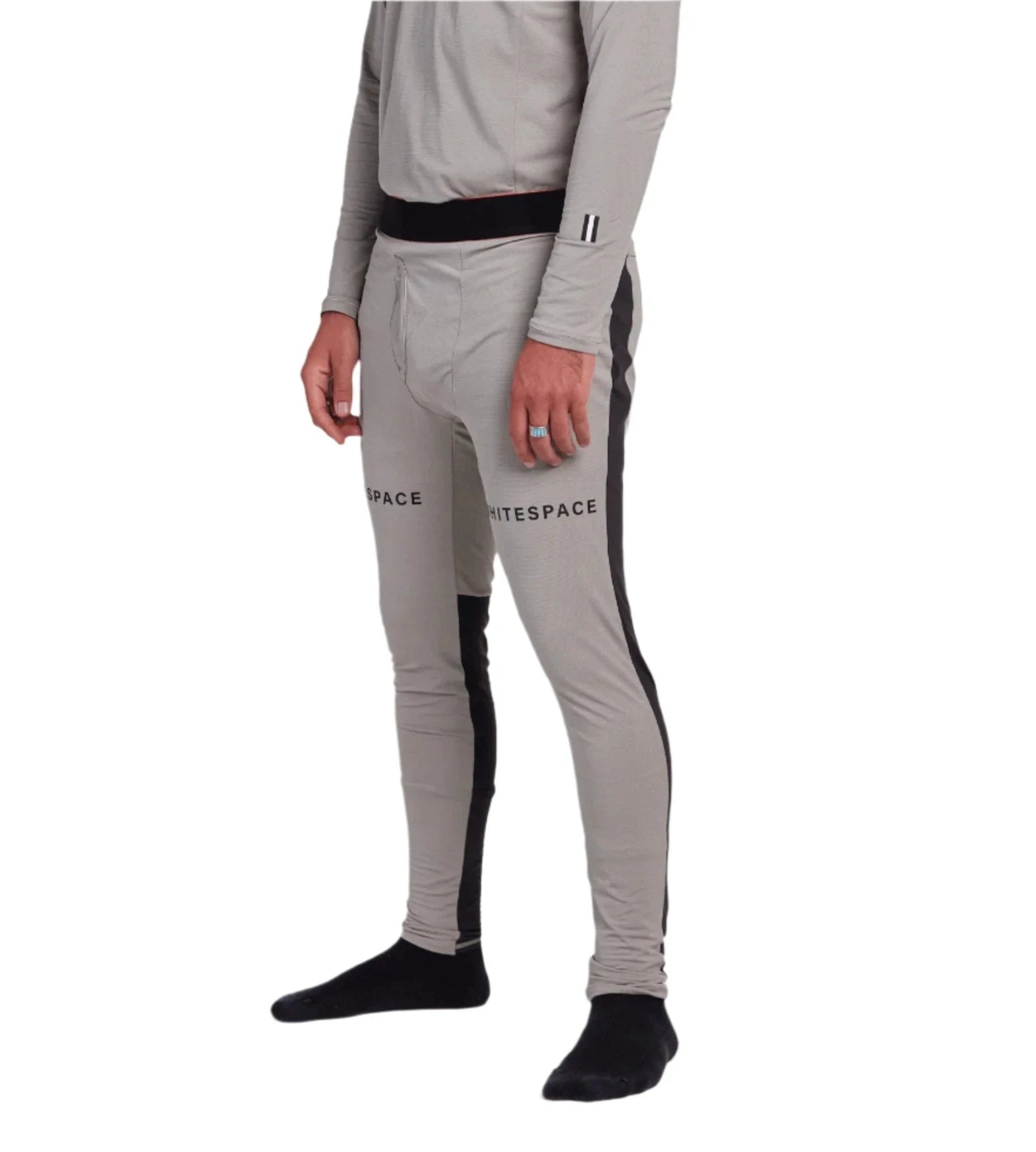 Whitespace Graphene Midweight Base Layer Bottom 2024 - A pair of light gray base layer bottoms with a black waistband and two small white logos on the left leg.