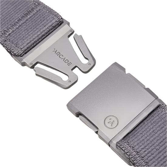 Arcade Atlas Stretch Belt 2025 - Gray belt with a textured weave pattern, featuring an adjustable metal buckle and a gray logo on the front.