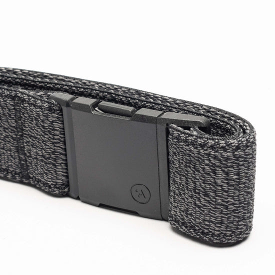 Arcade Atlas Stretch Belt 2025 - Black stretch belt with a textured pattern of small white and grey dots.
