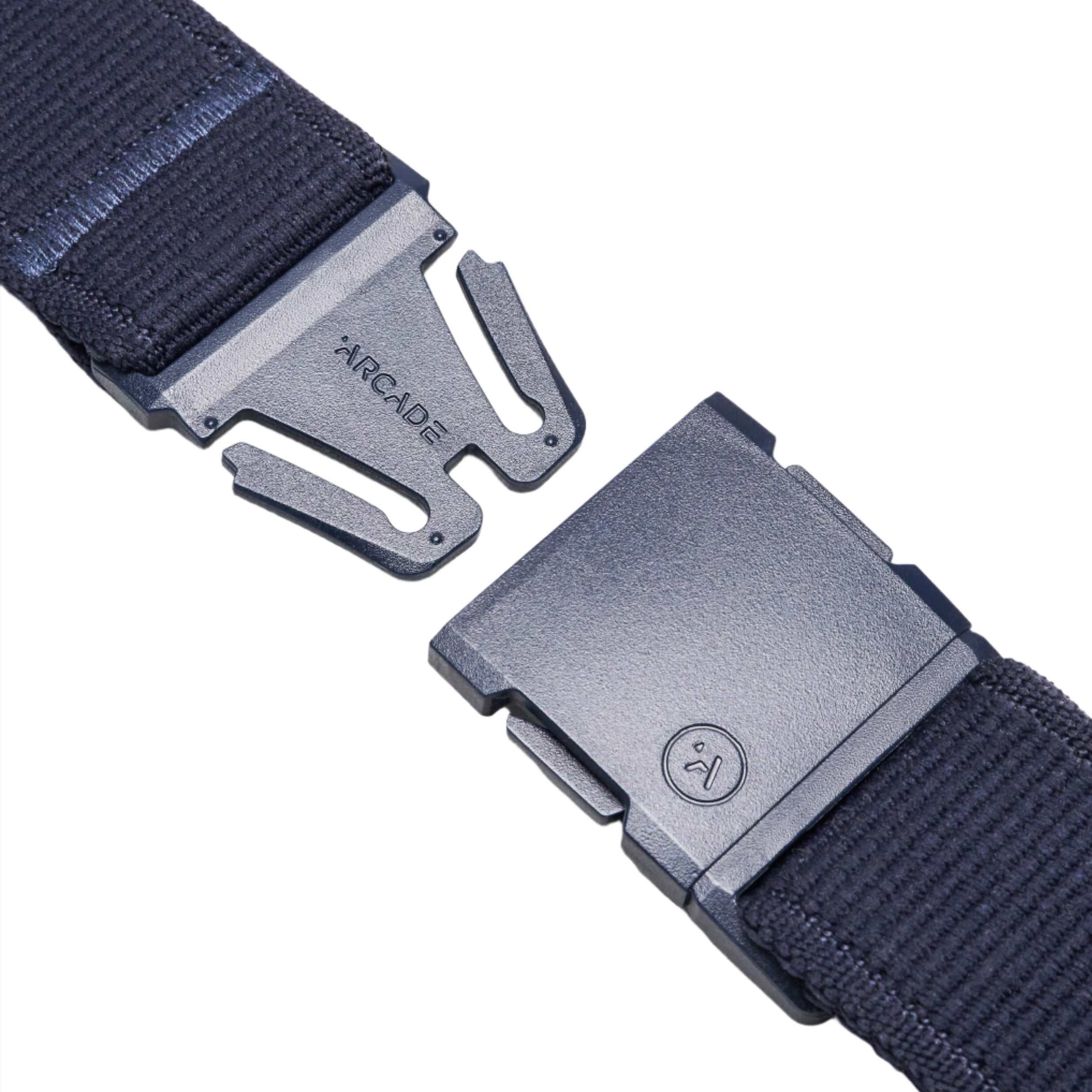 Close-up of the navy blue belt buckle, showing the two parts of the buckle separated. The brand name 'ARCADE' is visible on the buckle.