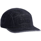 EDISON 5 PANEL CAP 2023 - A black denim cap with a faded pattern and a small embroidered logo on the front.