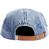 EDISON 5 PANEL CAP 2023 - A light blue denim cap with a faded pattern and a brown leather strap on the back.
