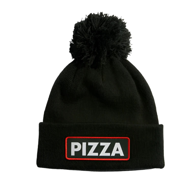 VICE POM BEANIE 2024 - Black beanie with a large, fuzzy black pom-pom on top.
