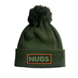 VICE POM BEANIE 2024 - A dark green beanie with a large pom-pom on top.