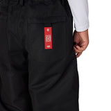 Black boys' shell pants with elastic waist and red logo patch on pocket