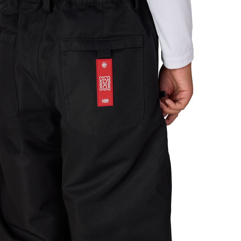 Black boys' shell pants with elastic waist and red logo patch on pocket