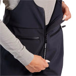 Whitespace Women's 3L High Waisted Softshell Bib 2024 - A dark gray bib with a high waist and zippered pockets, featuring a softshell material.