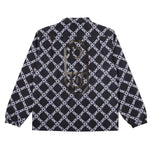 Airblaster Bruiser Shell Jacket 2025 - Black jacket with white geometric pattern and diagonal lines.