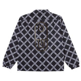 Airblaster Bruiser Shell Jacket 2025 - Black jacket with white geometric pattern and diagonal lines.