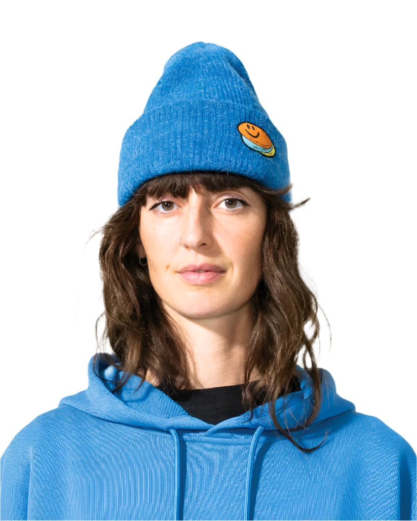 Bataleon 2 Way Beanie 2025 - A royal blue beanie with a smiley face patch on the front.