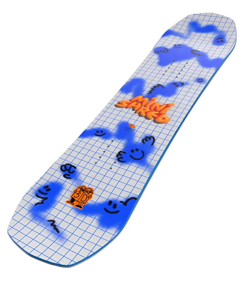 Bataleon Junior's Minishred Snowboard 2025 - A white snowboard with blue grid pattern and black smiley faces, featuring a small orange cartoon character in the bottom left corner.