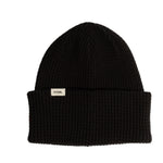 Black beanie with a Coal brand label on a light background