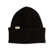 Black beanie with a Coal brand label on a light background