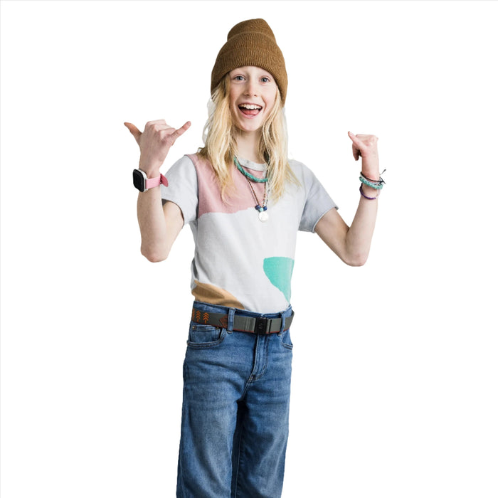 A young person wearing the olive green belt with orange chevron arrows. They are dressed in a casual outfit with a color-blocked t-shirt, blue jeans, and a brown beanie, smiling and making a playful hand gesture with thumbs and pinkies extended.