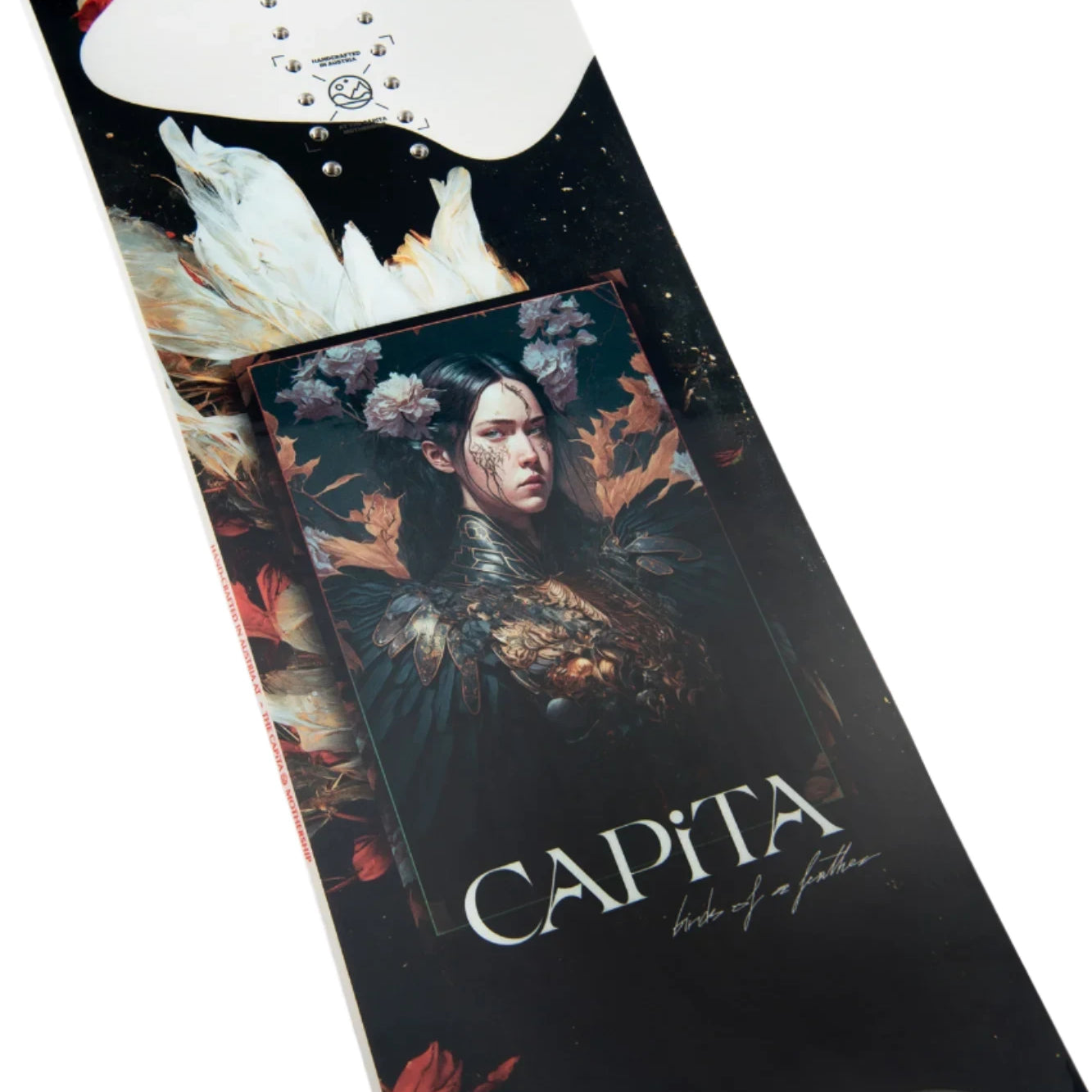CAPiTA Women's Birds of a Feather Snowboard 2025 - A black snowboard with white and red feathers, flowers, and a woman's face on it.