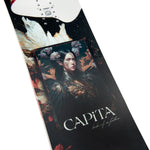 CAPiTA Women's Birds of a Feather Snowboard 2025 - A black snowboard with white and red feathers, flowers, and a woman's face on it.