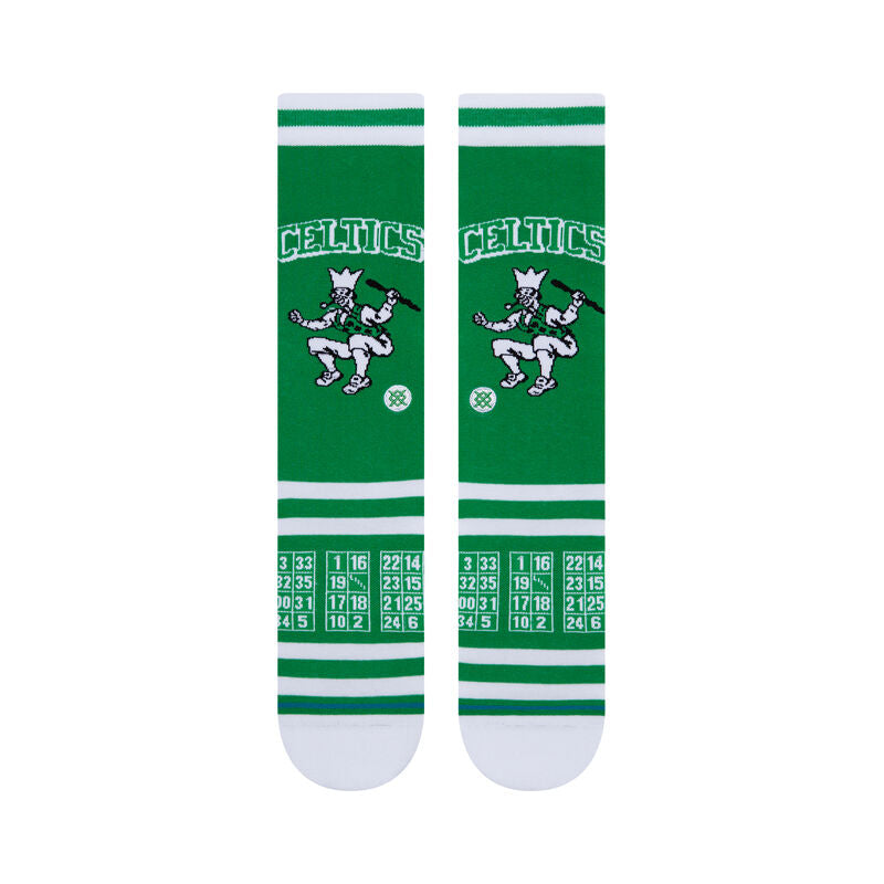 ROASTED C SOCK 2022 - Green socks with a white logo featuring a man skiing and the word "Roasted" in cursive above him.