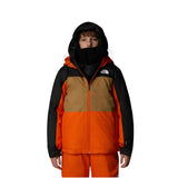 North Face Boys' Freedom Insulated Jacket - A young boy wearing a black, brown and orange jacket with a white logo on the left chest area.