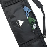 Burton Gig Snowboard Bag - A black snowboard bag with a white logo featuring a mountain peak and the word "BURTON" in bold letters, situated on the front of the bag.