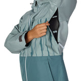 Women's insulated ski jacket, teal, side zipper close-up with hood and pocket detail