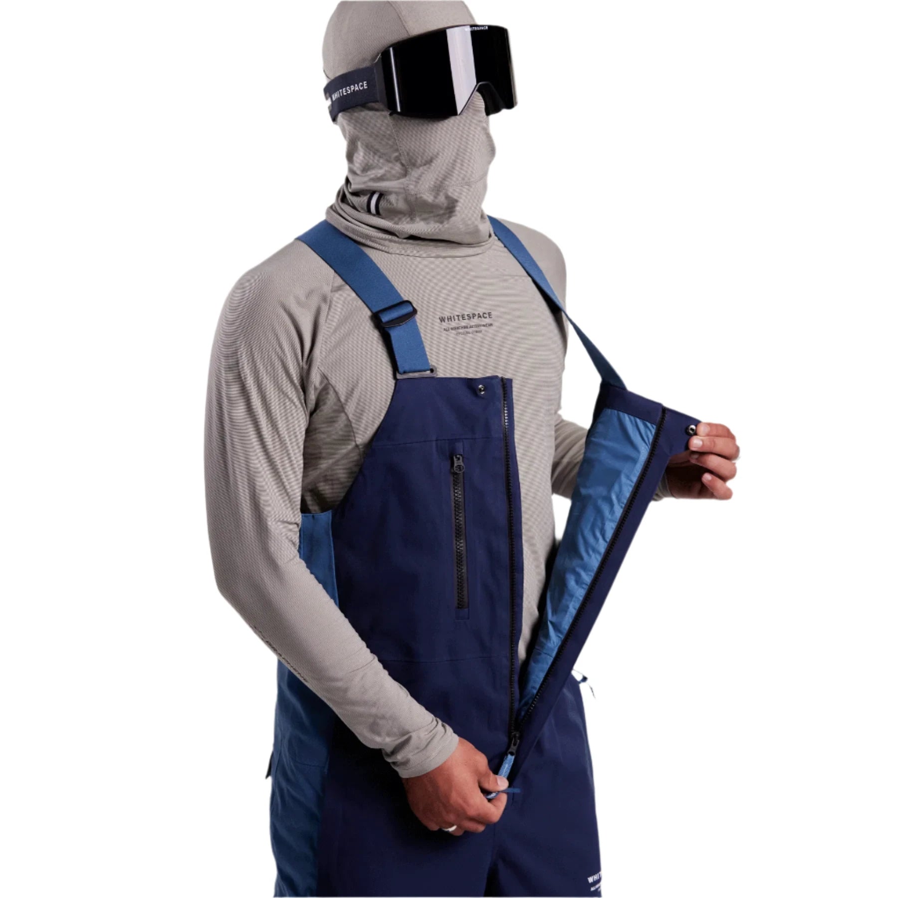 Whitespace 2L Cargo Insulated Bib Pants 2024 - A pair of dark blue snow pants with a cargo pocket on one thigh and two zippered pockets at the waist.