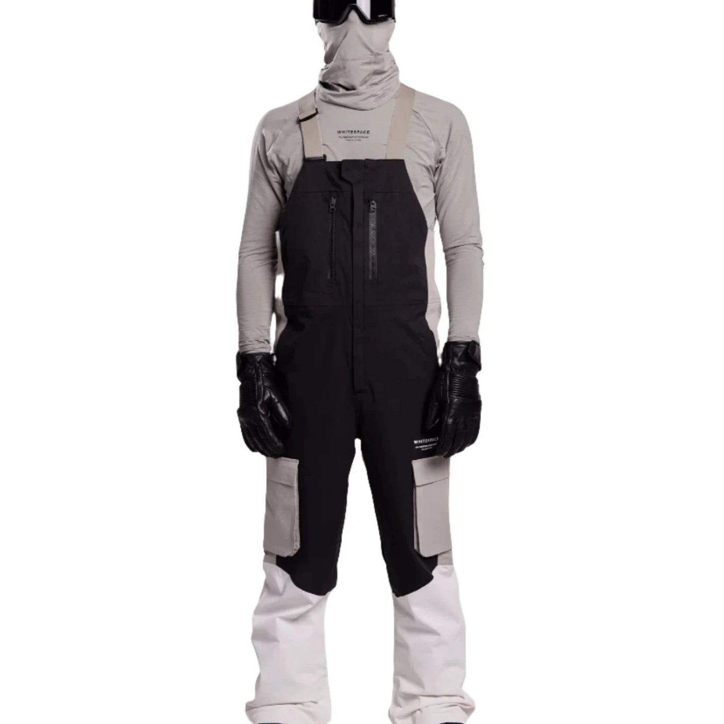 Whitespace 2L Cargo Insulated Bib Pants 2024 - Black bib pants with cargo pockets on each thigh and a black zipper down the front.