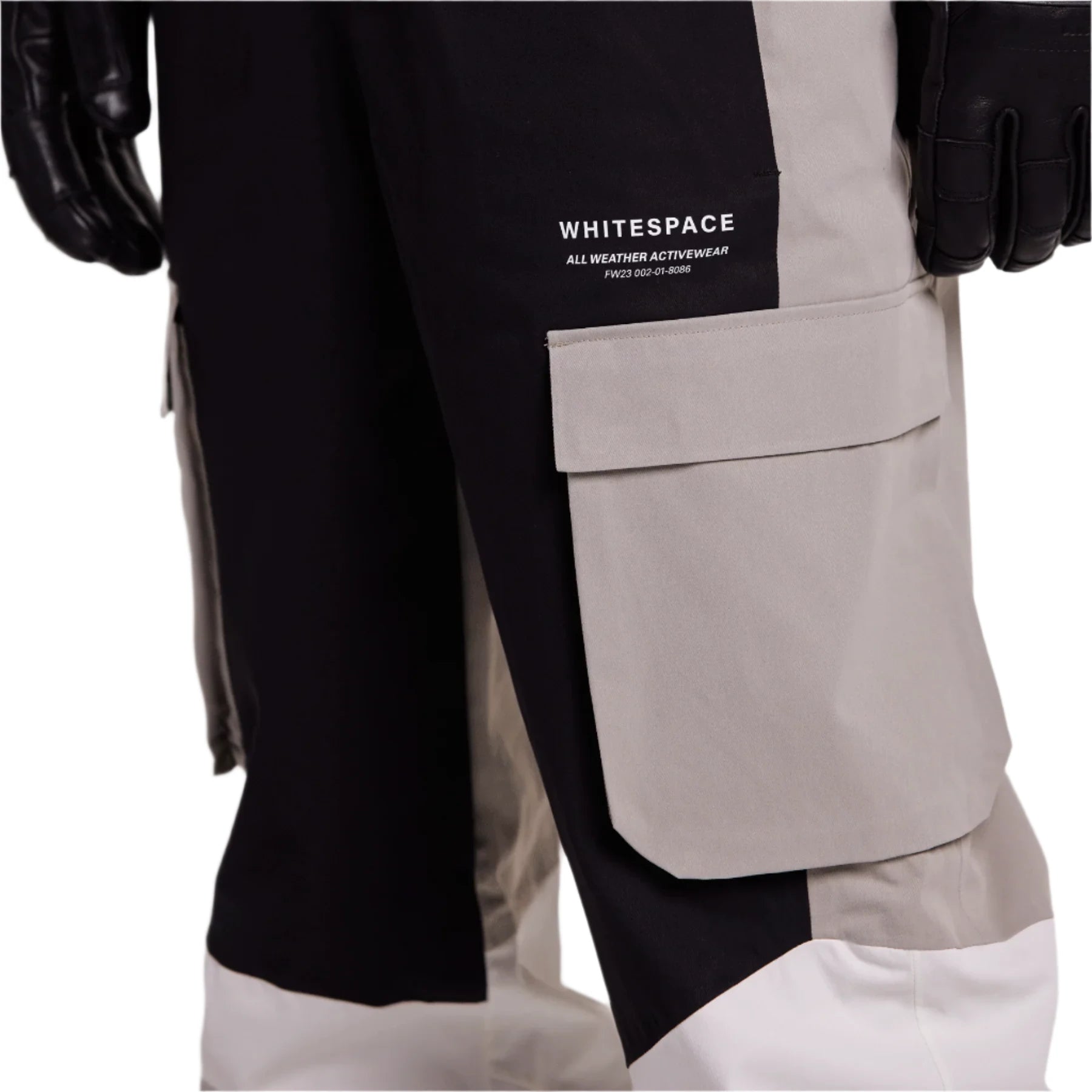 Whitespace 2L Cargo Insulated Bib Pants 2024 - Black bib pants with cargo pockets on each thigh and a white stripe down the side of one leg.