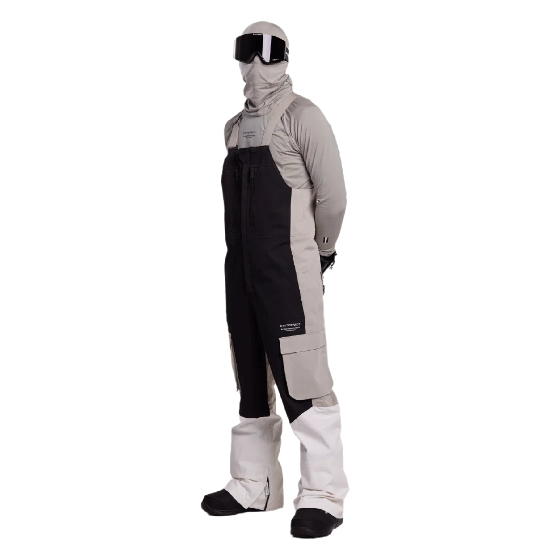 Whitespace 2L Cargo Insulated Bib Pants 2024 - Black bib pants with cargo pockets on each thigh and a white stripe down the side of one leg.
