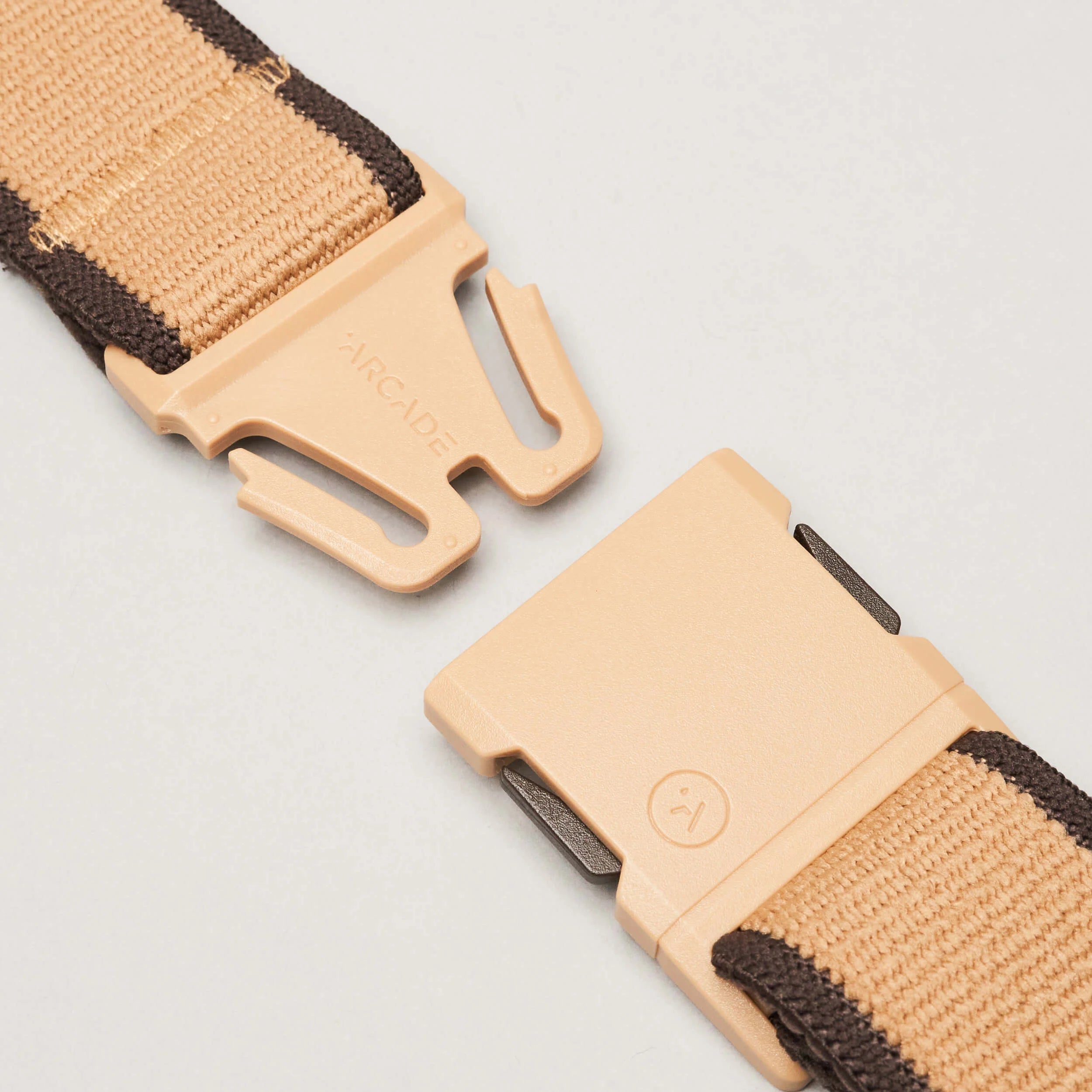 Arcade Carto Slim Belt 2024 - Beige belt with a woven pattern and silver buckle.
