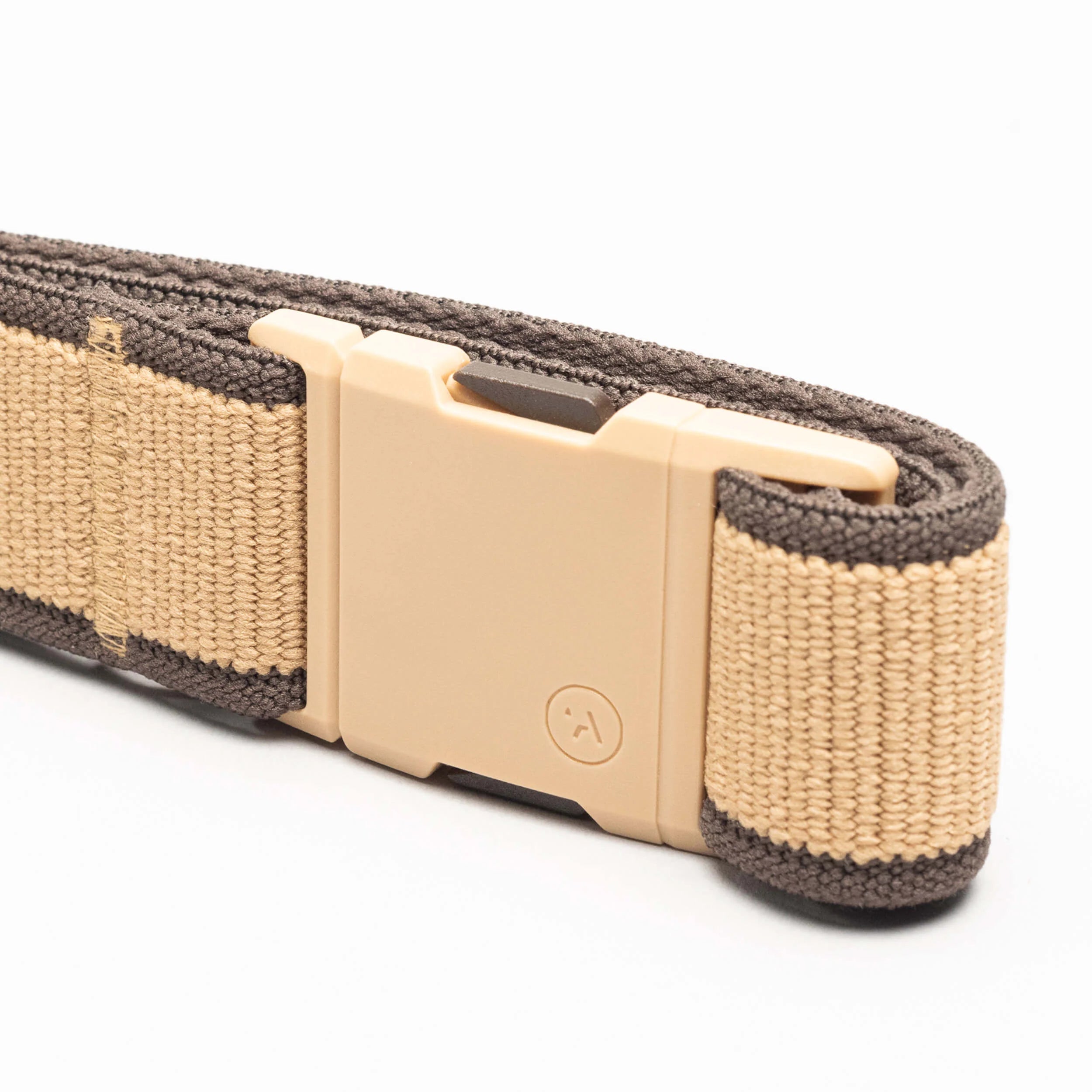 Arcade Carto Slim Belt 2024 - A tan belt with a woven texture and dark gray accents on the edges.