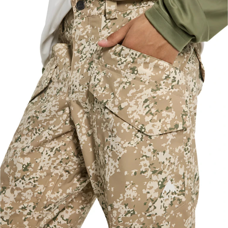 Burton Covert 2.0 2L Pants 2025 - A pair of khaki pants with a camouflage pattern and a small black button on the waistband.