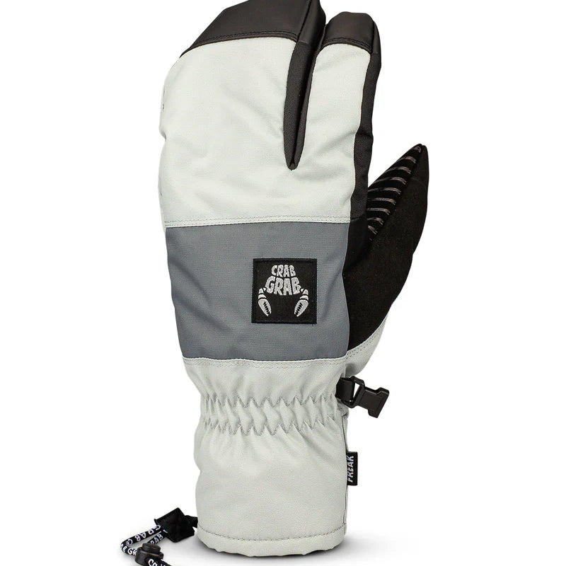 Crab Grab Men's Freak Trigger Mitt 2025 - A pair of white mittens with black trim and a black strap on the wrist, featuring a textured palm and thumb.