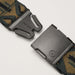 Detailed view of the belt buckle. The black buckle is unlatched, showing the ARCADE logo and the functional design of the clasp.