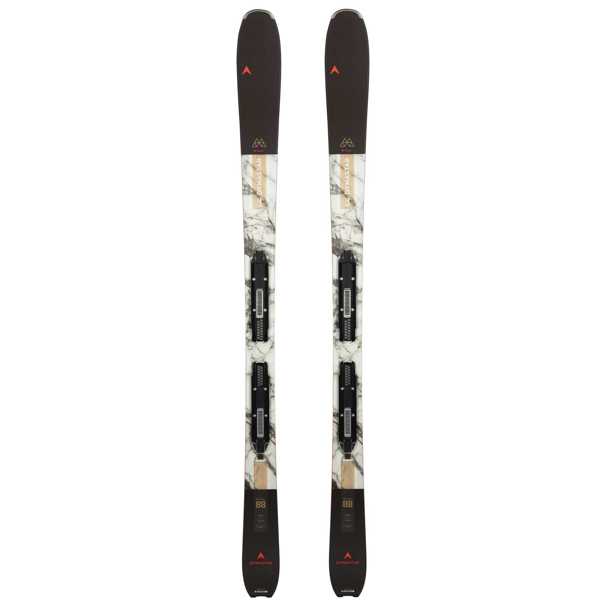 Dynastar M-Cross 99 Skis with SPX 14 Bindings - White skis with black bindings and a gold logo on top of each ski.