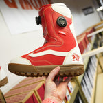 Vans Women's Encore Pro Limited Edition Snowboard Boots 2026 - A pair of red snowboard boots with white accents and a black BOA dial on the side.