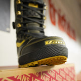 Vans Invado Pro Limited Edition Snowboard Boots 2026 - Black snowboard boots with yellow accents and a textured rubber sole.